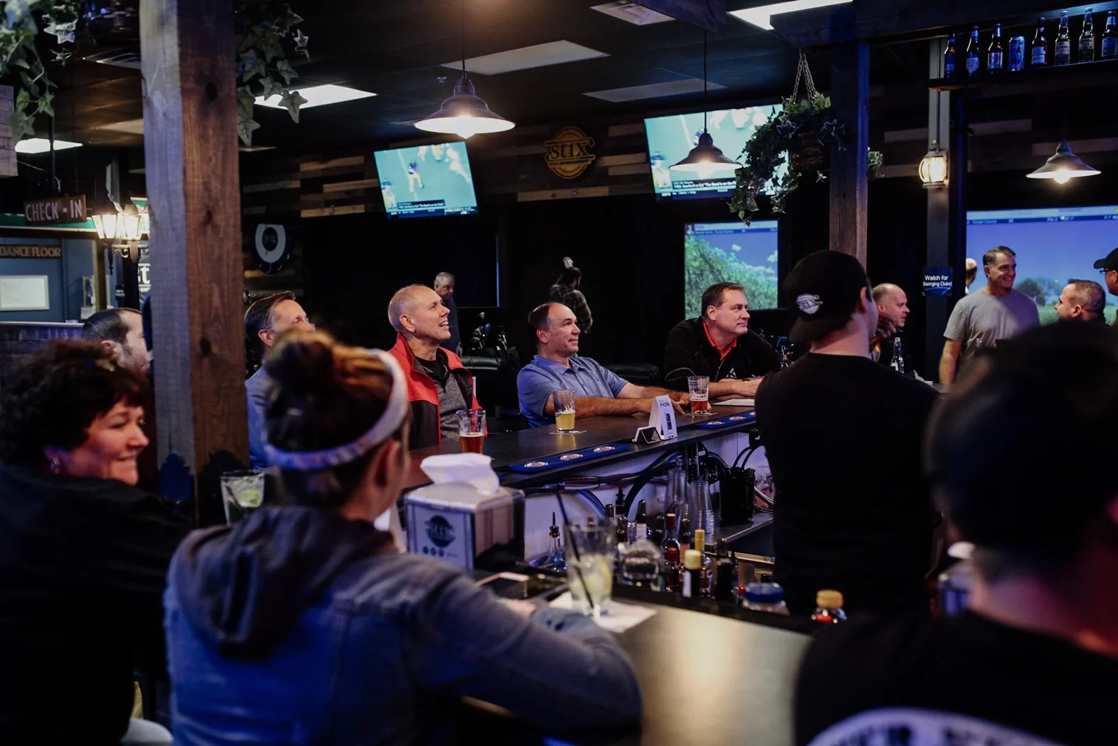 Guests gathered around the bar at Stix Germantown